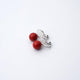 Clip-on earrings for both ears.