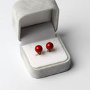 Clip-on earrings for both ears.