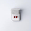 Clip-on earrings for both ears.